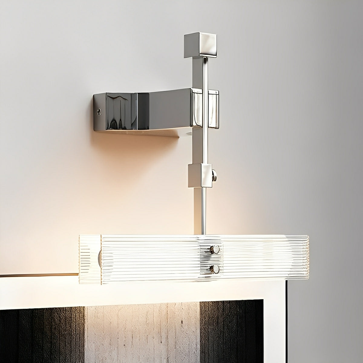 Sculptural mirror-finish LED wall sconce