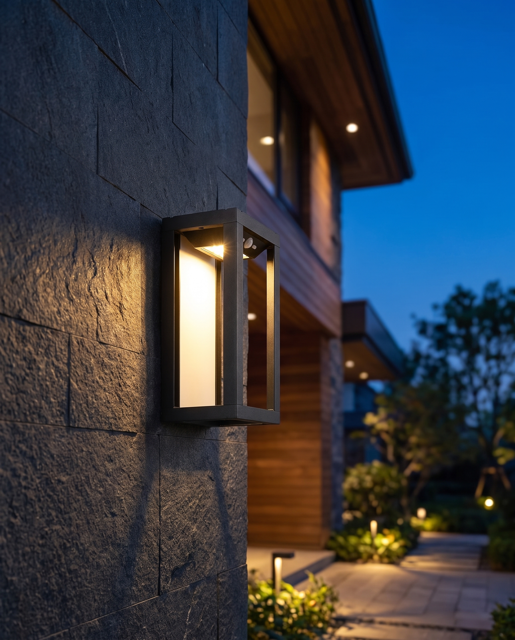 Luxury two-tone outdoor wall lamp, wide dusk entryway shot