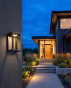 Luxury two-tone outdoor wall lamp, close-up dusk exterior detail