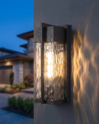 The Cascade Estate Wall Lantern, close-up ripple glass dusk detail