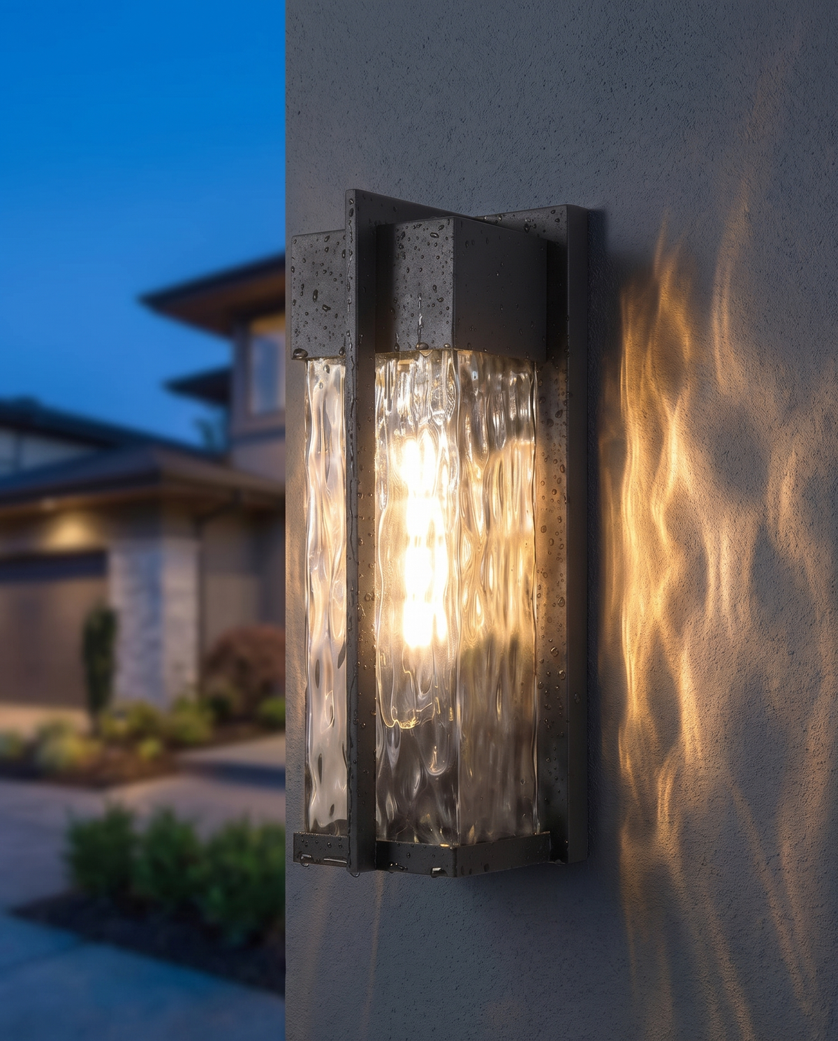 The Cascade Estate Wall Lantern, close-up ripple glass dusk detail