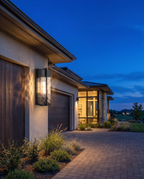 The Cascade Estate Wall Lantern, wide dusk driveway shot