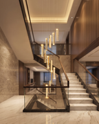 The Celestia crystal staircase chandelier glowing above a grand villa staircase