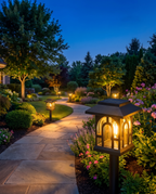 Luxury retro solar garden lanterns lining a flower bed at dusk